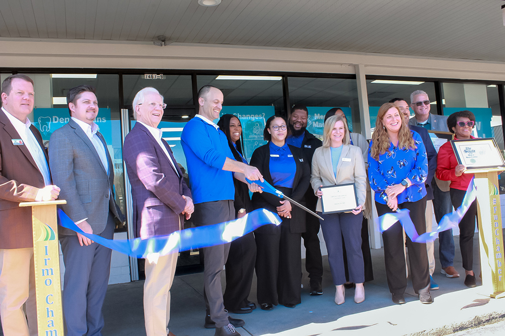 Ribbon cutting with Blue Cross employees at new retail center